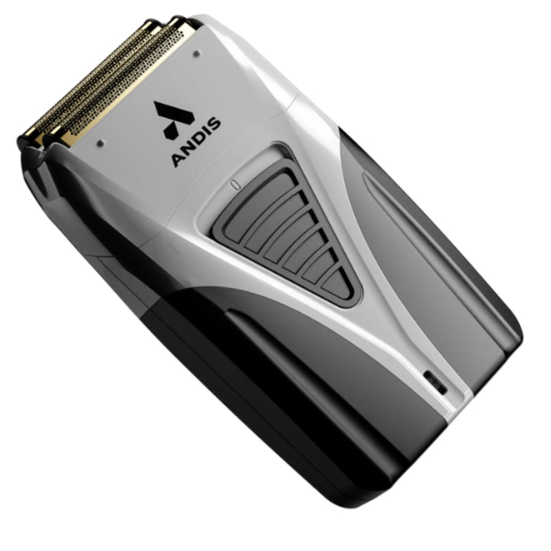 An ANDIS electric shaver shown at an angle on a plain white background. The shaver has a metallic silver and black body with a gold-toned shaving head.