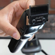 Andis Recon AMP'D DLC-coated blade mounted on a professional hair clipper