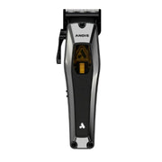 A handheld electric hair clipper shown vertically against a plain white background. The clipper has a black and silver body with a textured grip, a black clipper head, and a small yellow accent window in the center.