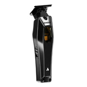 A black Andis cordless hair clipper shown from a side angle against a plain white background.