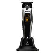 An Andis electric hair clipper standing upright on its black charging base against a plain white background.