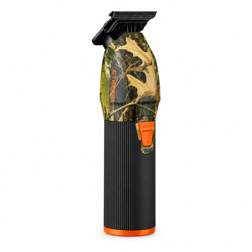 A cordless hair clipper with a black and orange body, featuring a transparent section showing a leafy camouflage pattern, on a solid white background.