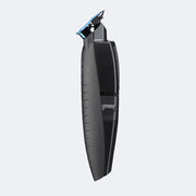 Black grooming tool on a light gray background