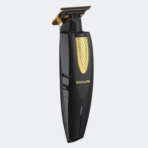 Black and gold BaBylissPro hair trimmer on a light gray background