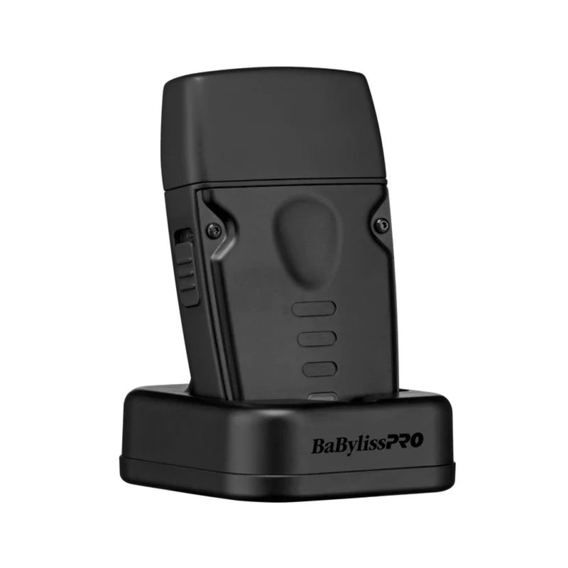 A black BaBylissPRO wireless hair styler attachment standing upright on its matching black charging dock against a plain white background.