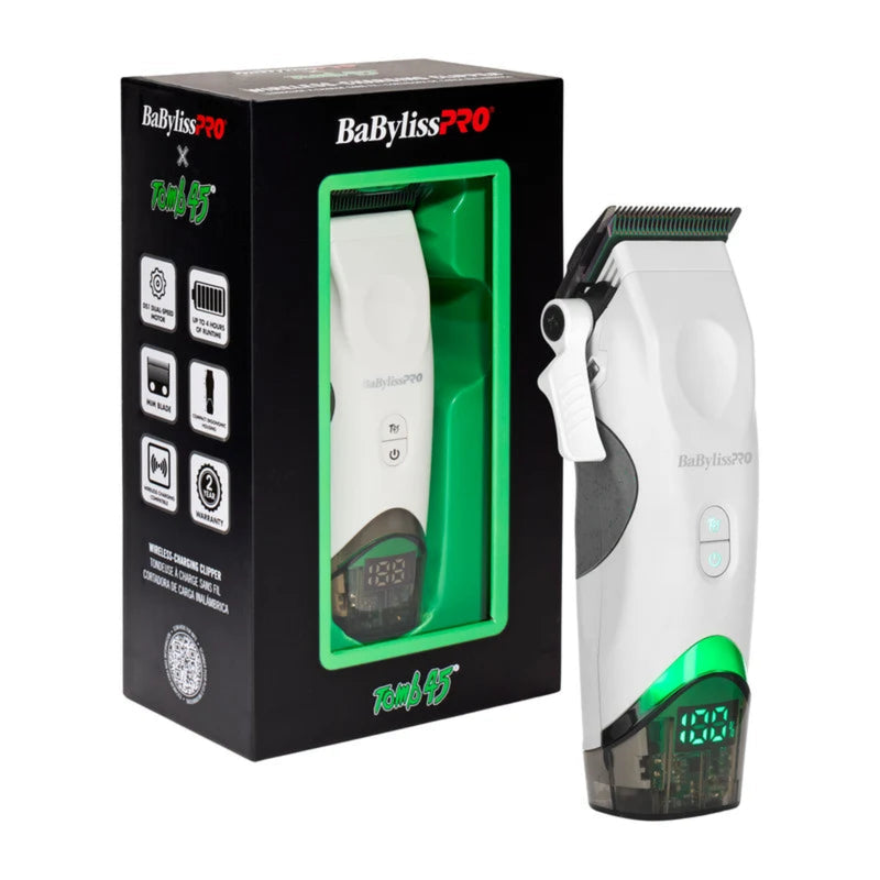 BaBylissPRO Baby EcoPro cordless hair clipper shown next to its retail packaging box. The clipper is white with a green illuminated base and a black clipper head, while the box is black with green and white branding.