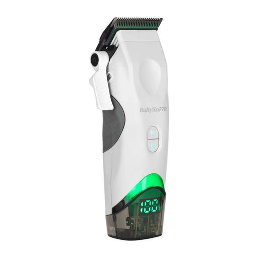 A white and gray BabyLiss Pro cordless hair clipper with a green illuminated trim line and a transparent collection container at the base, shown on a solid white background.