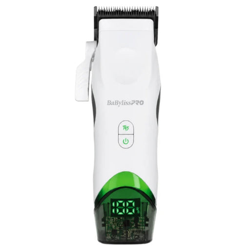 A BaBylissPRO cordless hair clipper shown from a front-facing perspective on a solid white background. The clipper features a white plastic body with a green accent band near the base, a black cutting head, and a green LED display showing '0.