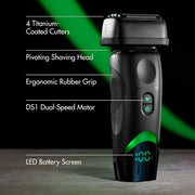 Black electric shaver with green illuminated accents and a digital battery display, shown with feature callout text on a dark studio background.