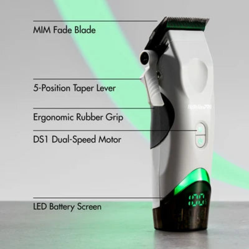 A cordless hair clipper shown on a gray surface with callout text labels pointing to features: MIM Fade Blade, 5-Position Taper Lever, Ergonomic Rubber Grip, DS1 Dual-Speed Motor, and LED Battery Screen.