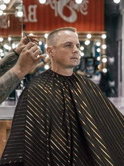 barber strong cape black with gold pinstripe