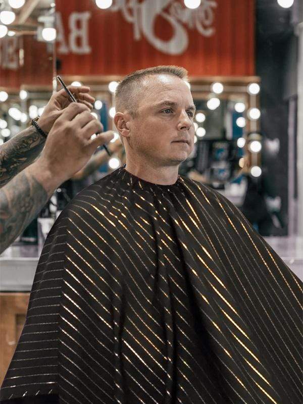 barber strong cape black with gold pinstripe