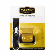 Carmic blade packaging with gold titanium fixed blade on a white background