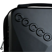 Close-up of Cocco logo on textured hard shell barber backpack case with premium finish