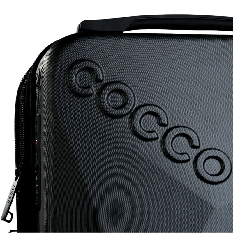 Close-up of Cocco logo on textured hard shell barber backpack case with premium finish