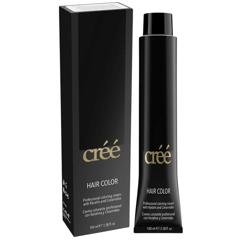 Créé hair color professional coloring cream shown in a black squeeze bottle next to its matching black packaging box, both featuring gold and white lettering on a white background.