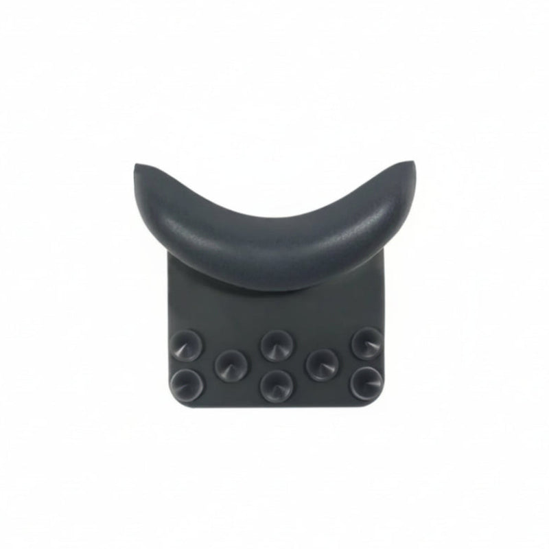 A dark gray crescent-shaped headrest support with a textured base and six circular suction cups, shown against a plain white background.
