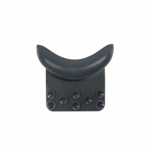 A dark gray crescent-shaped headrest support with a textured base and six circular suction cups, shown against a plain white background.