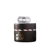 Black container with a brand logo and a razor blade on a white background