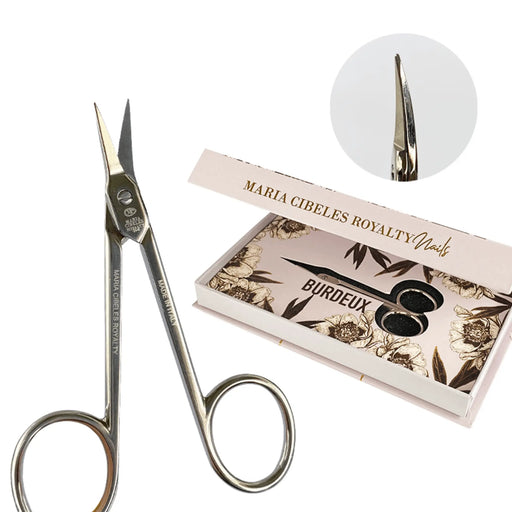 Nail scissors with a branded box on a white background