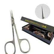 Pair of silver scissors with a black box labeled 'Maria Cibeles Royalty Nails' on a white background.