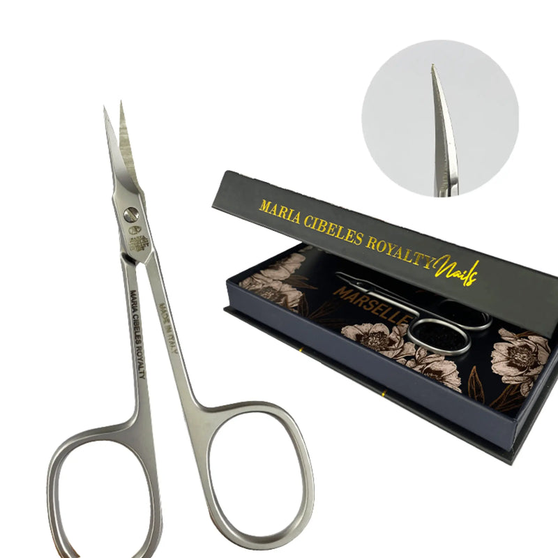 Pair of silver scissors with a black box labeled 'Maria Cibeles Royalty Nails' on a white background.