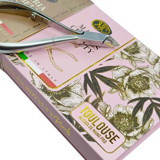 Manicure set with scissors and clipper on a pink box with floral design