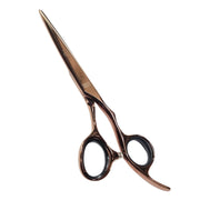 Metallic rose gold hair shears with black finger rings, shown on a plain white background.