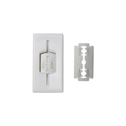 Shaving cream container with a razor blade on a white background