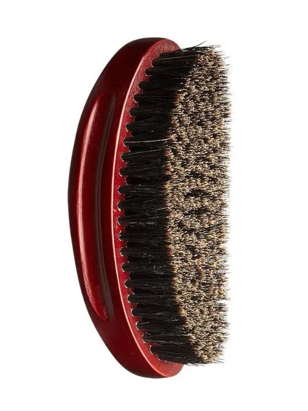 Red-handled brush with bristles on a white background