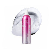 Pink hair spray can with white foam on a white background