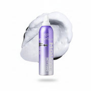 Purple hair product bottle with white cap on a white background