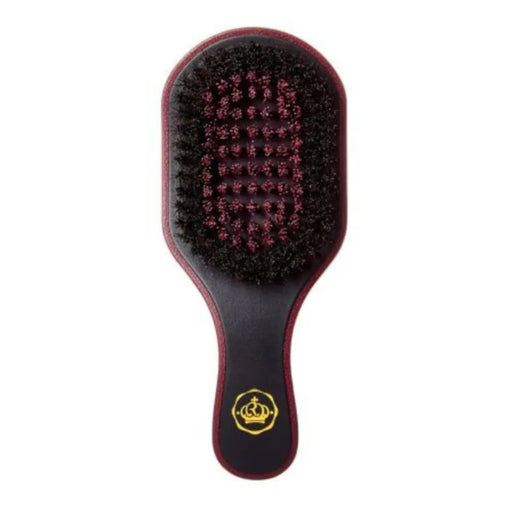 A hairbrush with a dark reddish-brown handle and head, black bristles, and a gold crown logo near the base, shown against a plain white background.