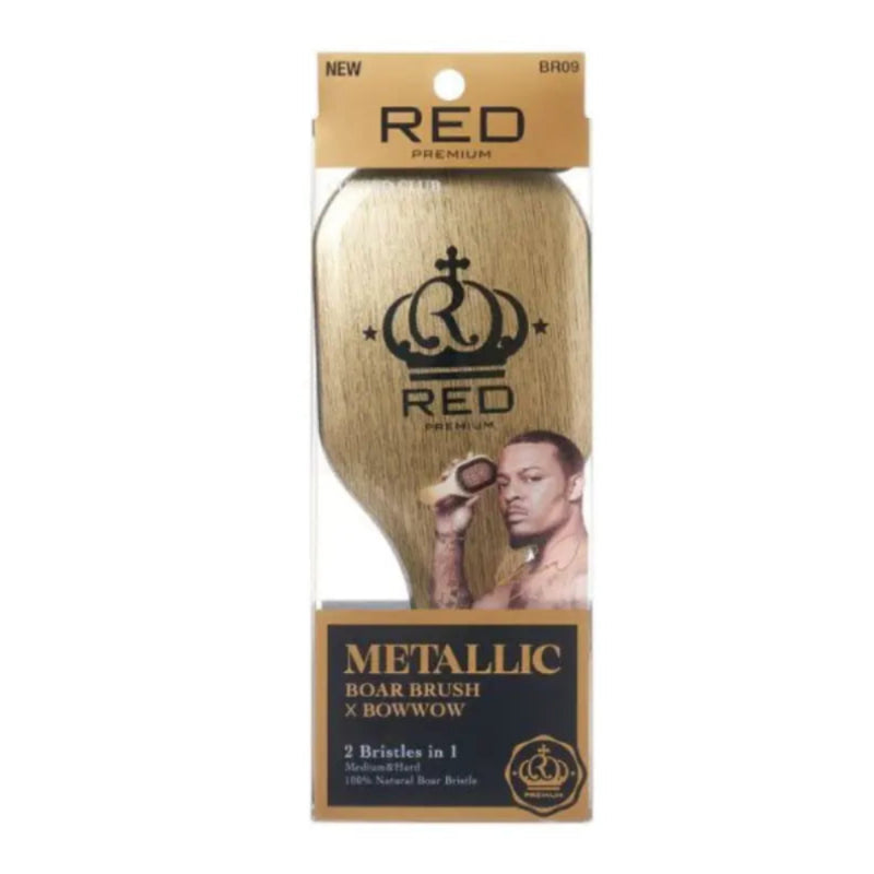 Red Premium Metallic Boar Brush in its retail packaging, featuring a metallic gold brush head with a black crown logo and a model graphic, set against a plain white background.