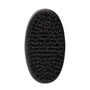 A close-up of a black oval brush head with dense, fine bristles, shown against a plain white background.