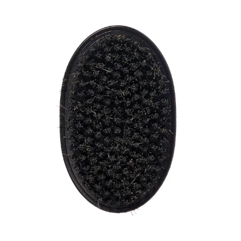 Black oval brush with bristles on a white background
