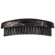 Black hairbrush with bristles on a white background