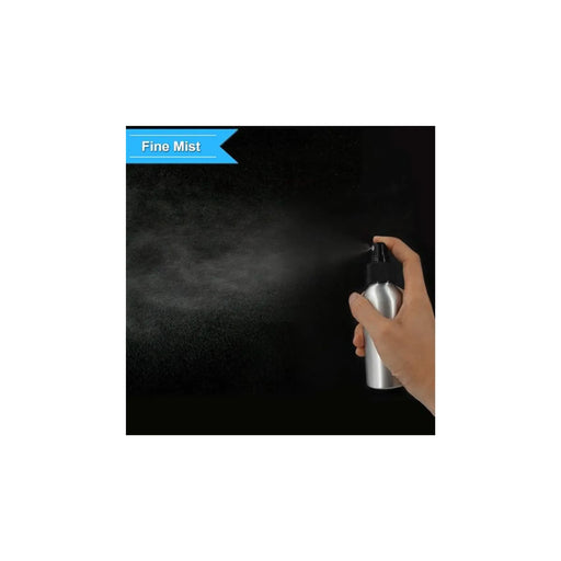 A hand holding a silver spray bottle that emits a fine white mist against a black background, with a blue banner reading 'Fine Mist' in the top left.