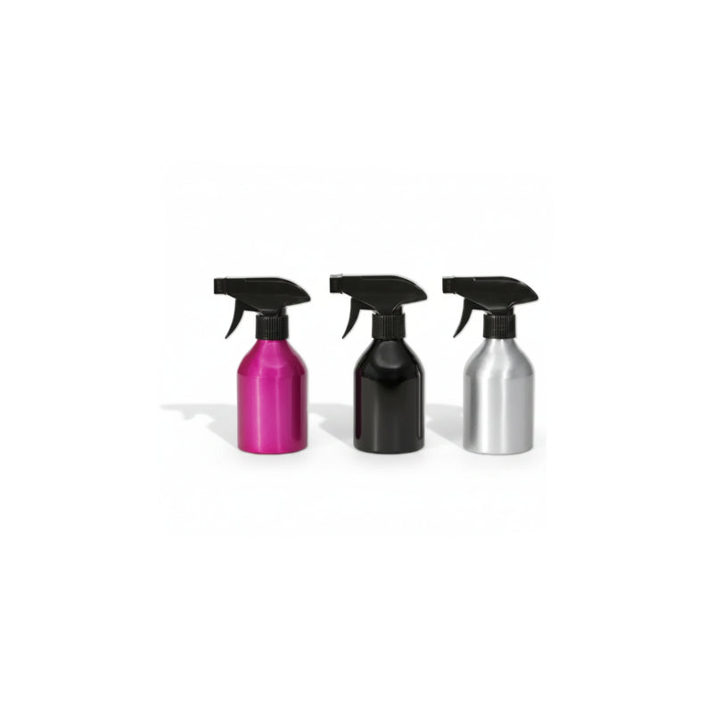 Three spray bottles with black trigger sprayers, shown side by side in metallic pink, black, and silver finishes on a plain white background.
