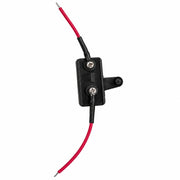 A black plastic electrical relay or switch component with two red wires connected via black boots and silver screw terminals, shown on a plain white background.
